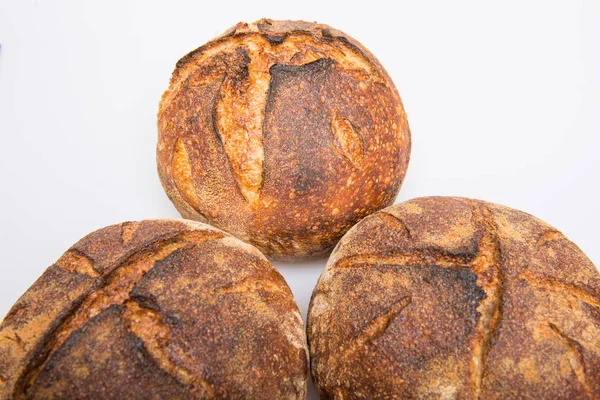 Loafs of round artisan sourdough bread — Stock Photo, Image