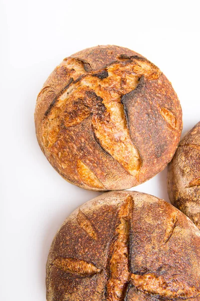 Loafs of round artisan sourdough bread — Stock Photo, Image