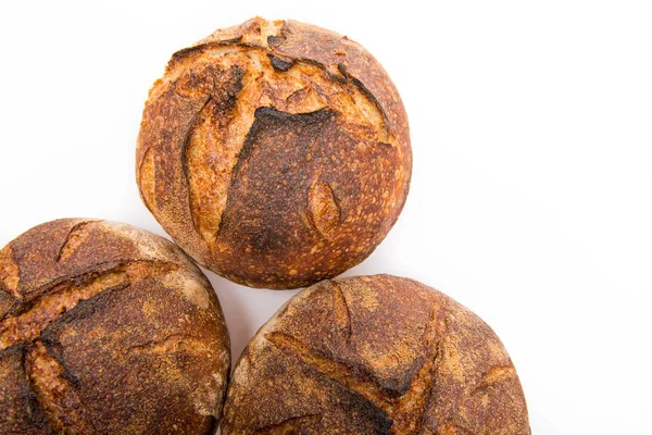 Loafs of round artisan sourdough bread — Stock Photo, Image