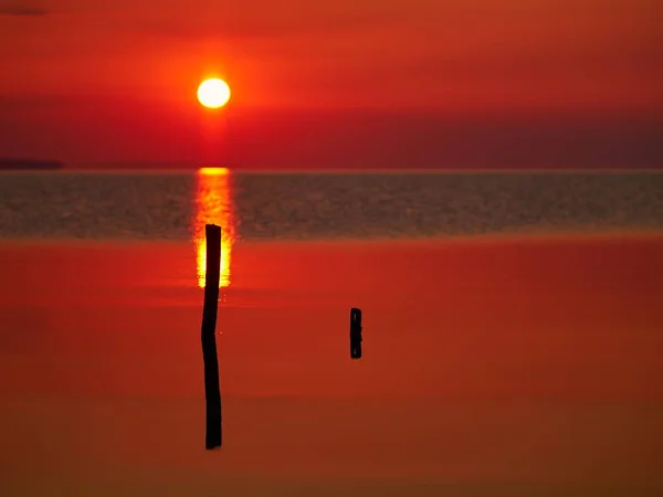 Beautiful sunset over water — Stock Photo, Image