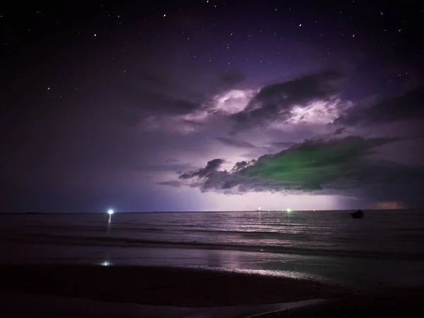 Lightning strike in the darkness, storm on the sea — Stock Photo, Image