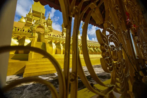 Golden temple gate at Pha That Luang, a Buddhist pagoda in Vient Stock Photo