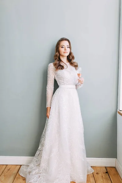 Stylish wedding in European style. Portrait of the bride in the style of fine art, white dress.