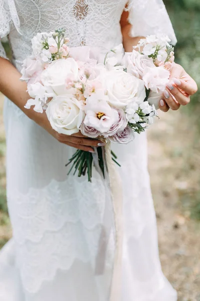 Printing and decor for a wedding with flowers. Modern Bridal bouquet in hand.