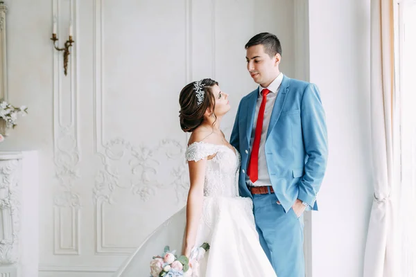 Modern ceremony in European style. Beautiful wedding couple in atmospheric forest with rocks.