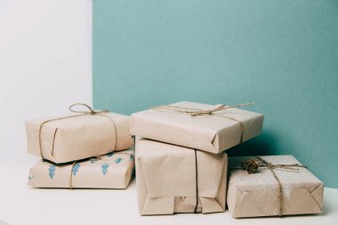 Set of boxes on a green background. Gifts in Kraft packaging with ribbon. 