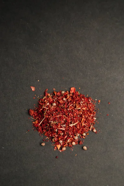 Cloves, garlic and pepper for seasoning. Spices on a black background.