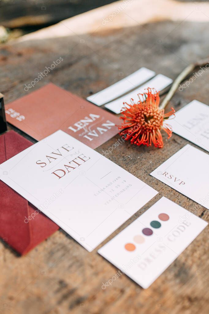  Graphic arts decor for a wedding ceremony. Postcards with elements of Marsala. Wedding invitations with red roses.