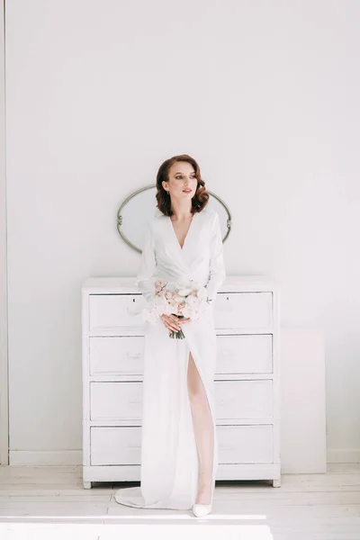 Stylish European wedding. Modern trends in the image of the bride. Bright portrait of the bride in the interior Studio.