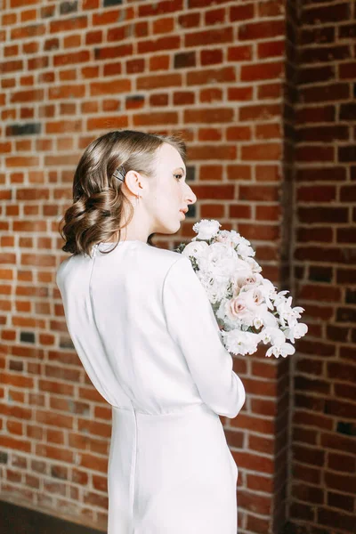 Stylish European wedding. Modern trends in the image of the bride. Bright portrait of the bride in the Museum.