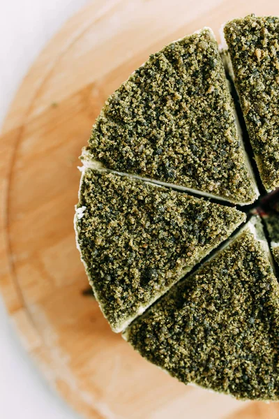 Green natural spinach cake, vegan. Layer cake with spinach and cream.
