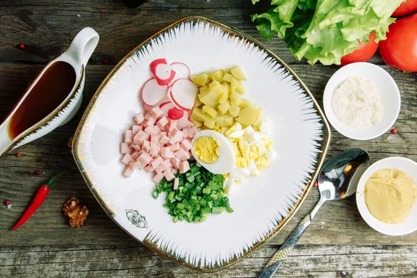 Restaurant dish on a wooden background with vegetables. Okroshka salad with kvass and horseradish on a plate. — Stock Image Restaurant Dish Wooden Background Vegetables Okroshka Salad Kvass Horseradish Plate Royalty Free Stock Photos