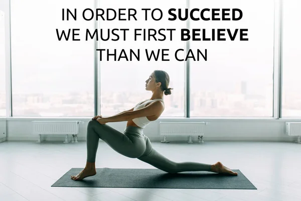 Sports motivation and success quotes, yoga classes. Athletic girl trains and stretches in the gym.