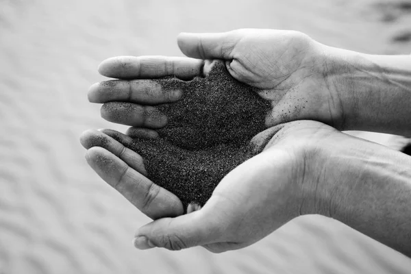 Sand of the desert in human hands — Stock Photo, Image