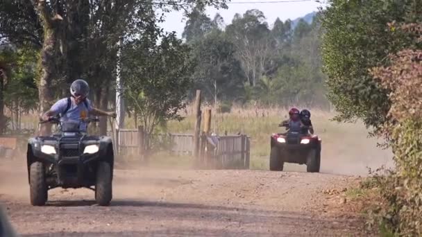 Two People Riding All Terrain Vehicle Atv Rough Road — Stock Video