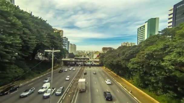 Traffic Moving Highway Surrounded Buildings Greenery Timelapse — Stock Video