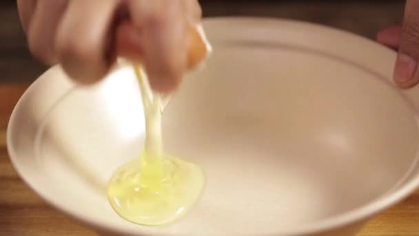 Eggs Breaking Brown Eggs White Bowl Front Angle — Stock Video