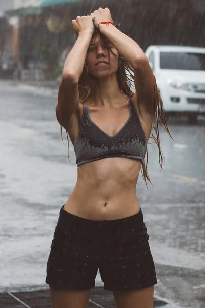 Girl in the rain in Thailand