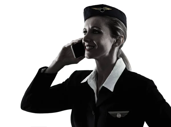 Stewardess légiutas-kísérő személyzet nő a telefon sziluett — Stock Fotó