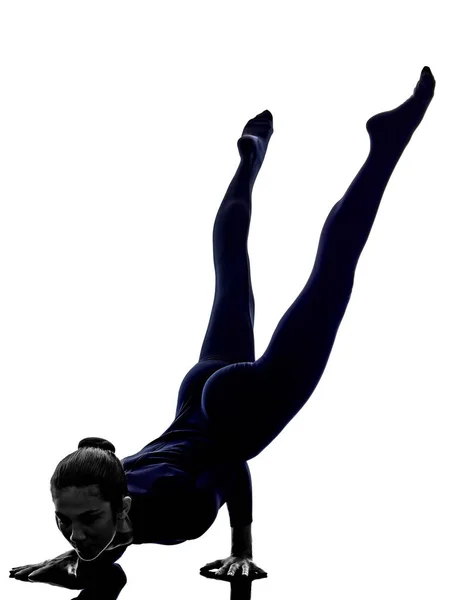 Woman exercising Mayurasana peacock pose yoga silhouette — Stock Photo, Image