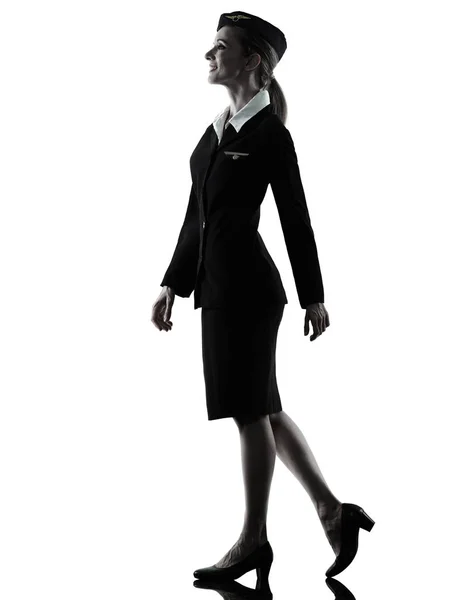 Stewardess cabin crew vrouw lopen geïsoleerde silhouet — Stockfoto