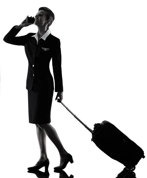 Stewardess Flugbegleiterin am Telefon isolierte Silhouette — Stockfoto