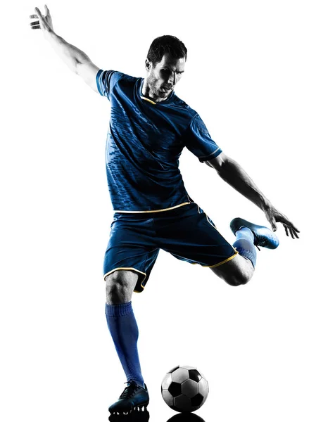 Piłka nożna gracz człowieka kopiąc sylwetka na białym tle — Zdjęcie stockowe