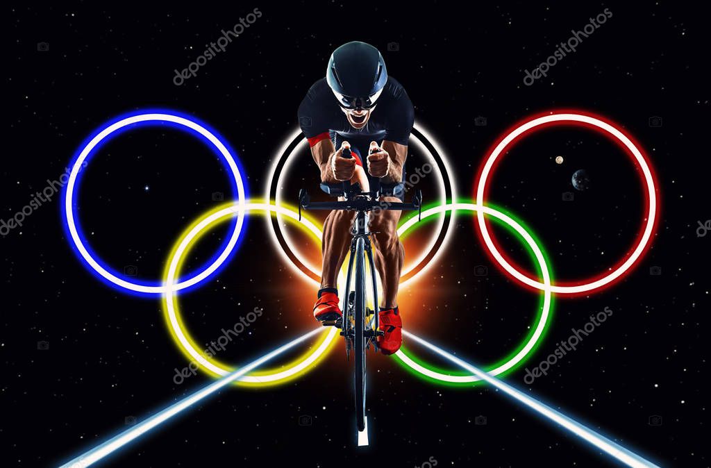 Cyclist cycling with olympic games rings logo on isolated black background