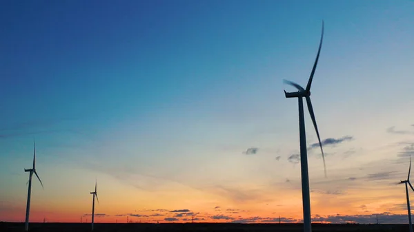 Wind turbine from aerial view - Sustainable development, environment friendly, renewable energy concept. Aerial View Of Wind Turbines In Blue Sky.