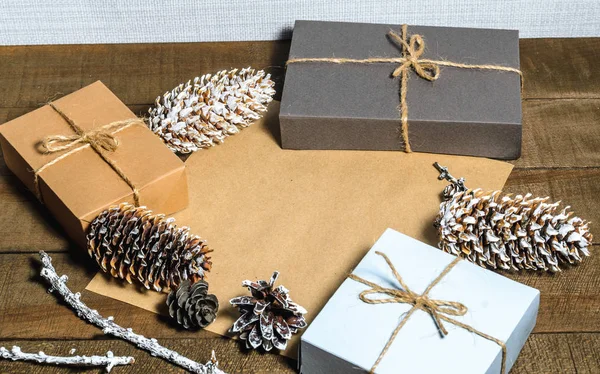 Boxes with gifts, cones, free space — Stock Photo, Image