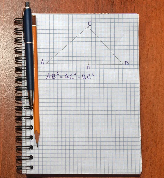 Page with formulas and the Pythagorean theorem with pen — Stock Photo, Image