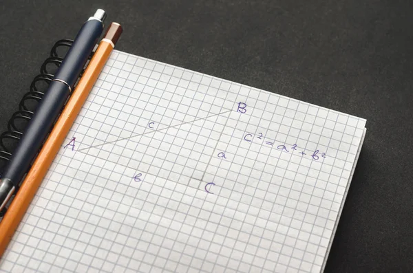 Page with formulas and the Pythagorean theorem with pen — Stock Photo, Image