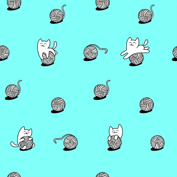 beyaz kedi yün topları ile oynuyor.