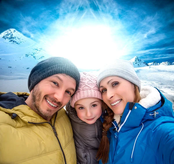 Wintertime young family — Stock Photo, Image