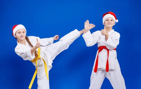 Cheerful athletes beat kick and point the finger super — Stock Photo, Image