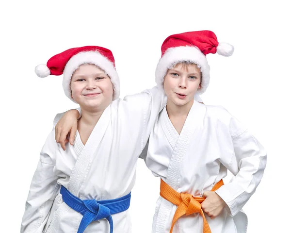 Pojkar idrottare i kepsar av Santa Claus — Stockfoto