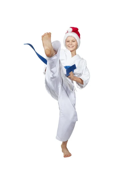 Sportovec s modrým pásem a v čepici Santa Claus — Stock fotografie