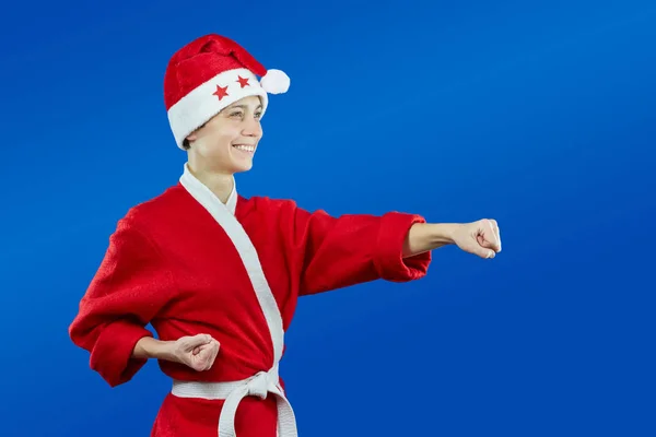 Klädd som jultomte idrottsman beats punch arm — Stockfoto