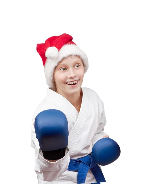 Chica en la tapa de Santa Claus está en el karate rack — Foto de Stock