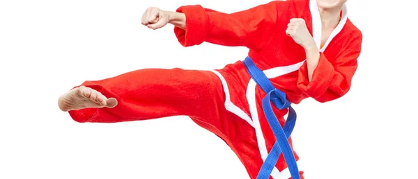 Karateka with a blue belt is beating kick leg — Stock Photo, Image