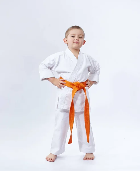 On a white background little athlete in karategi — Stock Photo, Image