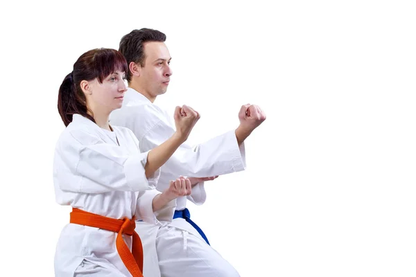 Man and woman in karategi stand in the rack karate — Stock Photo, Image