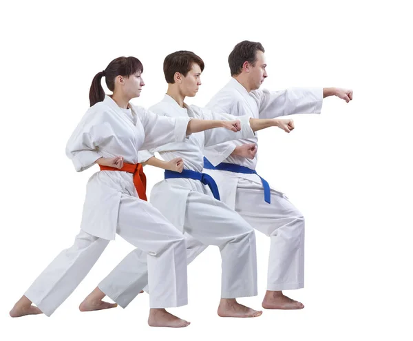 In karategi man and two women are beating punch arm isolated — Stock Photo, Image