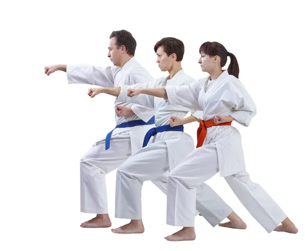 흰색 바탕에 karategi에서 스포츠맨 절연 펀치 팔을 꺾고 있습니다. — 스톡 사진