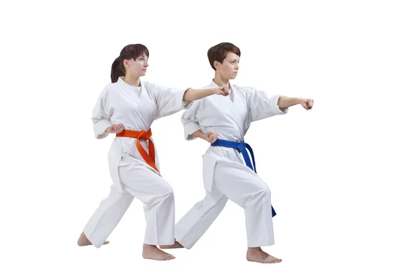 Women in karategi are training punch arm on a white background — Stock Photo, Image