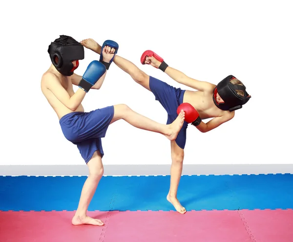 Boys Protective Helmets Doing Paired Exercises — Stock Photo, Image