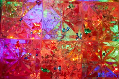 Kareler ve yıldızların arkaplanındaki çarpık ışık şekilleri