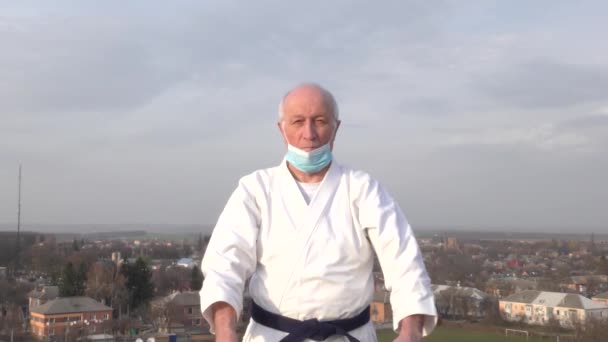 Old Athlete Medical Mask His Face Beats Punches City Background — Stock Video