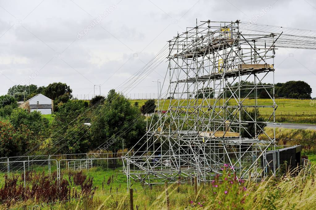 Scaffold tower in a field