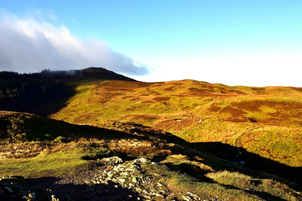Shadows and low clouds over Lord's Seat — Stock Photo, Image